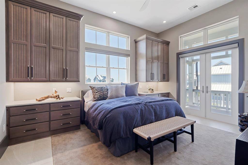 One of two secondary bedrooms on the 3rd floor with access to the balcony.