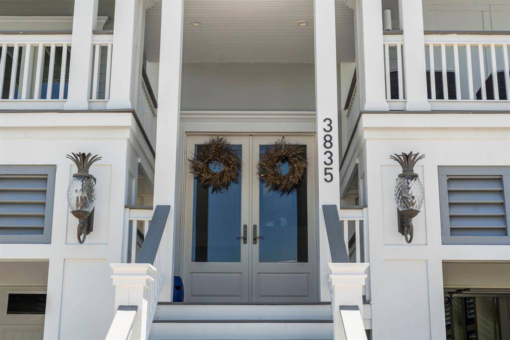 Grand entrance with french doors and staircase to usher you in.