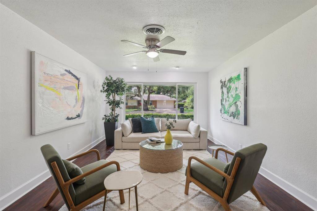 A bright, inviting living room with a large window offering ample natural light.