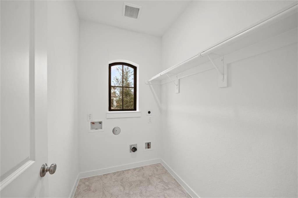 Laundry/Uiiltiy room with gas and electric hook ups.