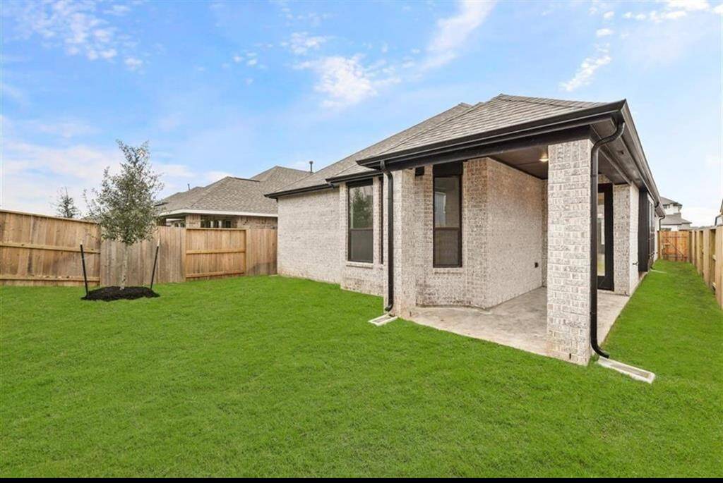 Covered patio and nice size backyard.