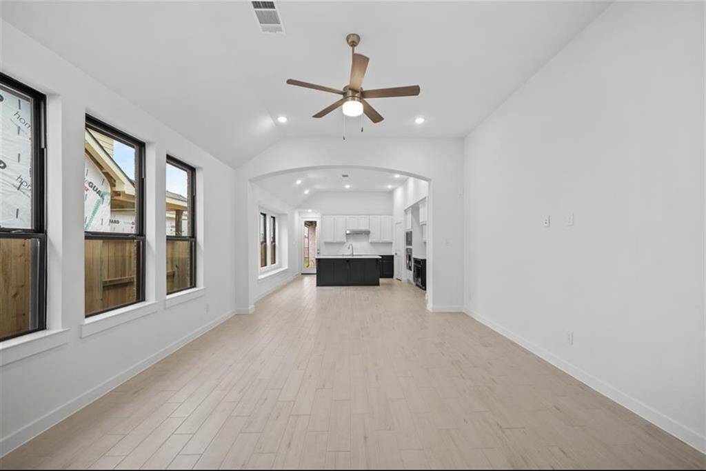 Open Floorplan with wood tile flooring in main living areas.