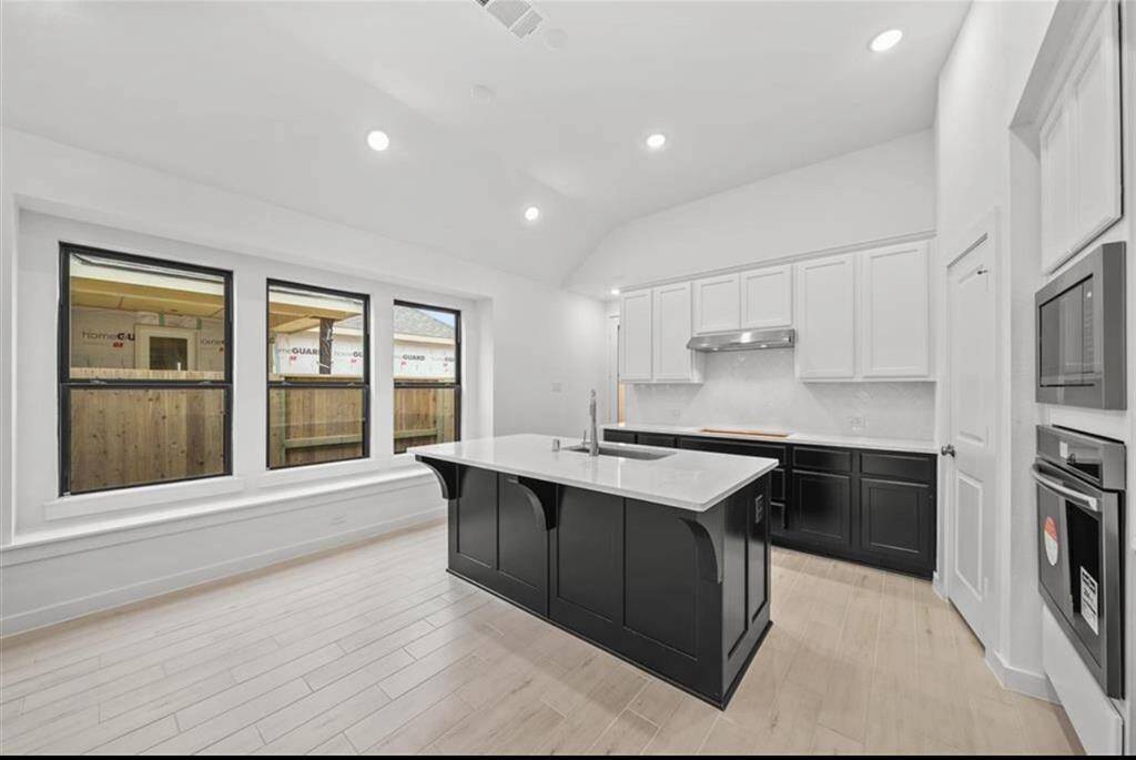 Chefs kitchen with island.