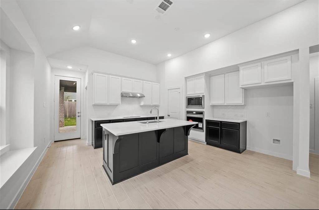 Stainless steel appliances with built in oven and microwave.