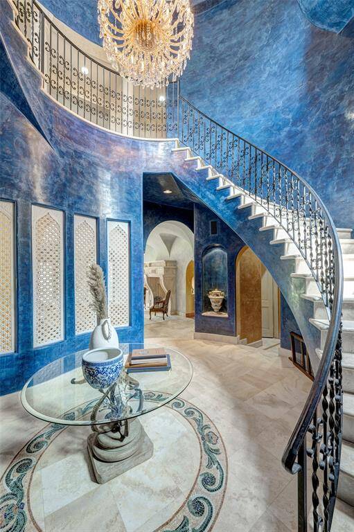 Grand foyer with Murano chandelier, Venetian plaster, and marble screens from India