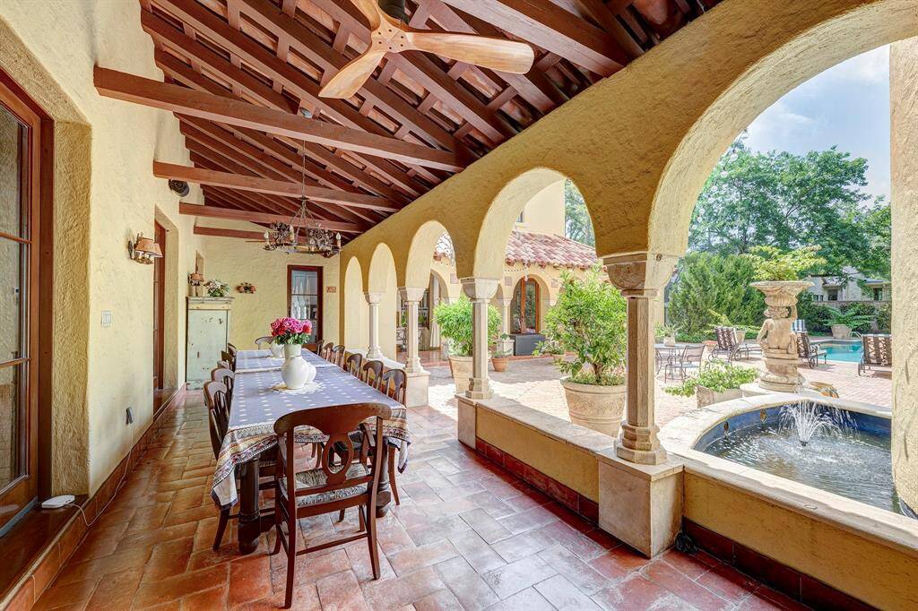 Courtyard w/ views of the pool, fountain, and adjacent to kitchen