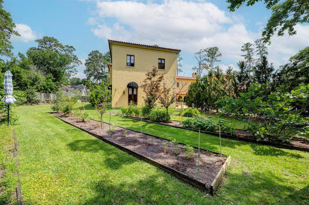 Side yard with gardens (herbs, fruits, and more)