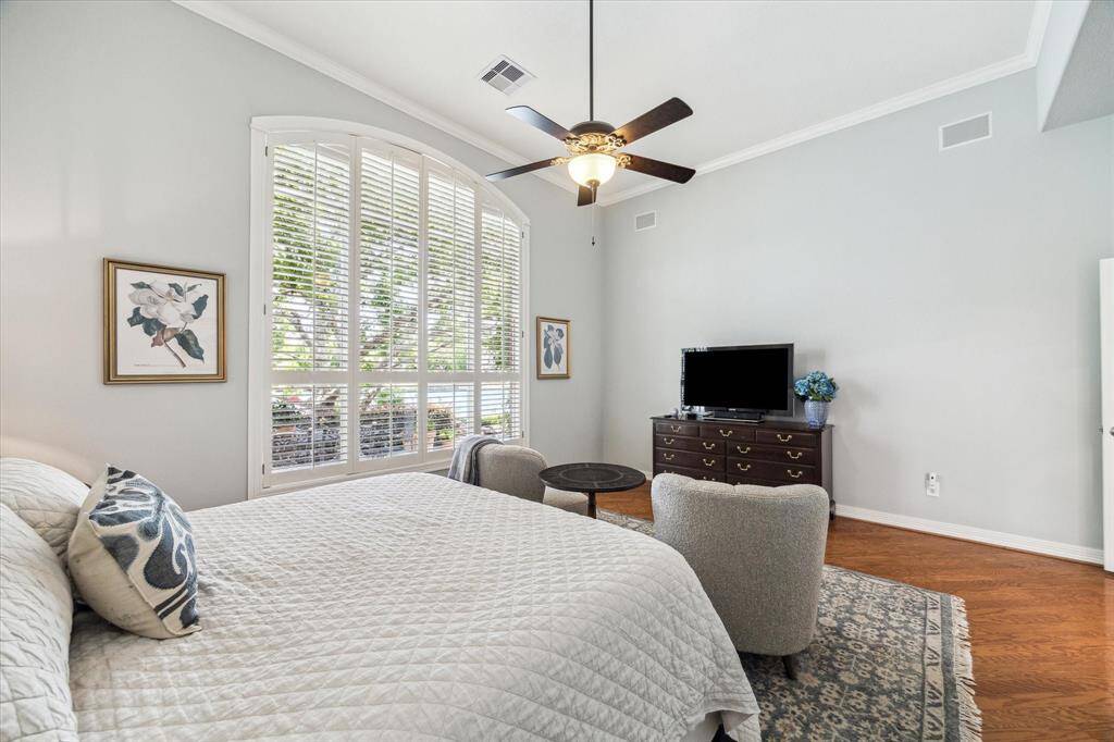 Fabulous downstairs primary bedroom with high ceilings, gleaming hardwoods, ceiling fan and abundant natural light plus THE VIEW!!!