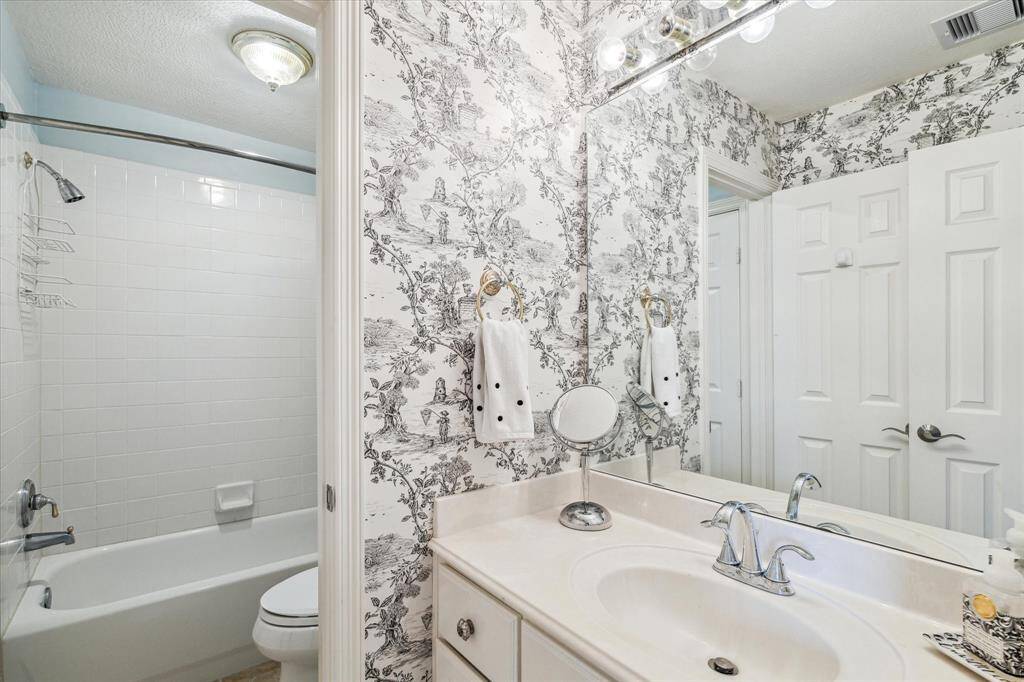 Hollywood bath is so tastefully done and serves the upstairs bedrooms with separate sinks and tub/shower combination.