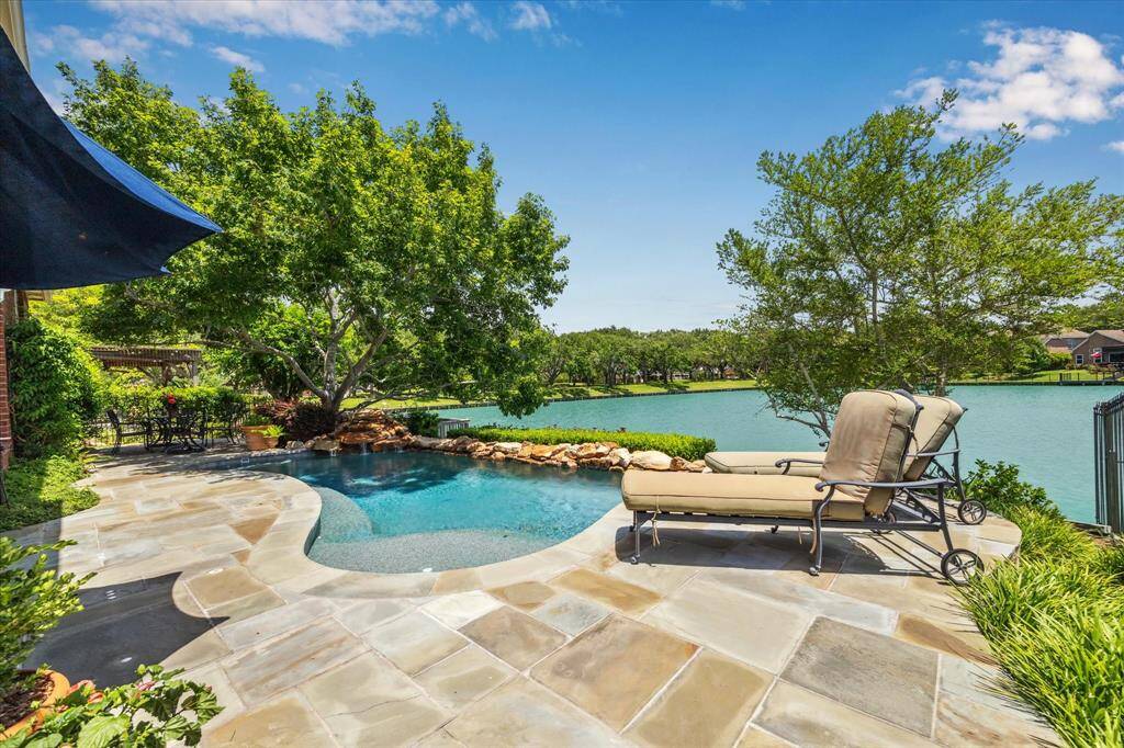 The back yard is an oasis with tiered decking, heated pool and covered patio. This is like having your own private resort