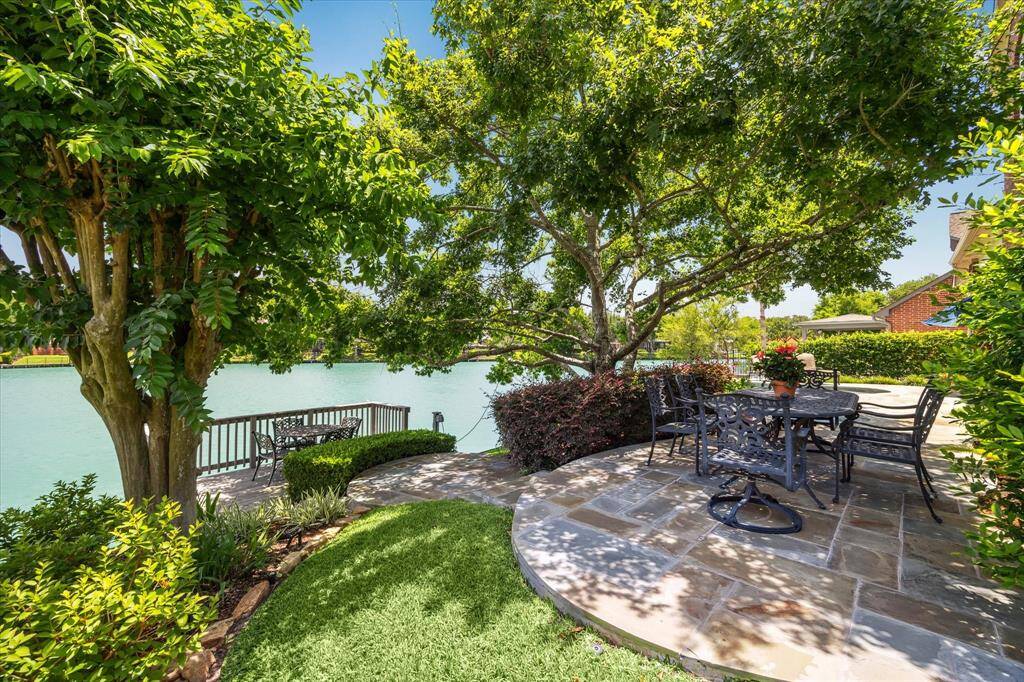 How can you get any more tranquil than this.  Tiered decking down to a lovely dining area adjacent to the boat dock.  Surrounded by beautiful trees and attractive landscaping.
