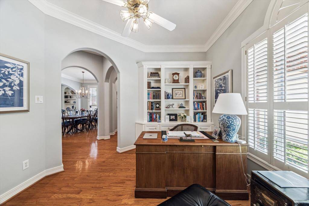 Office is located off of the entry hall and is complete with crown molding and gleaming hardwoods.