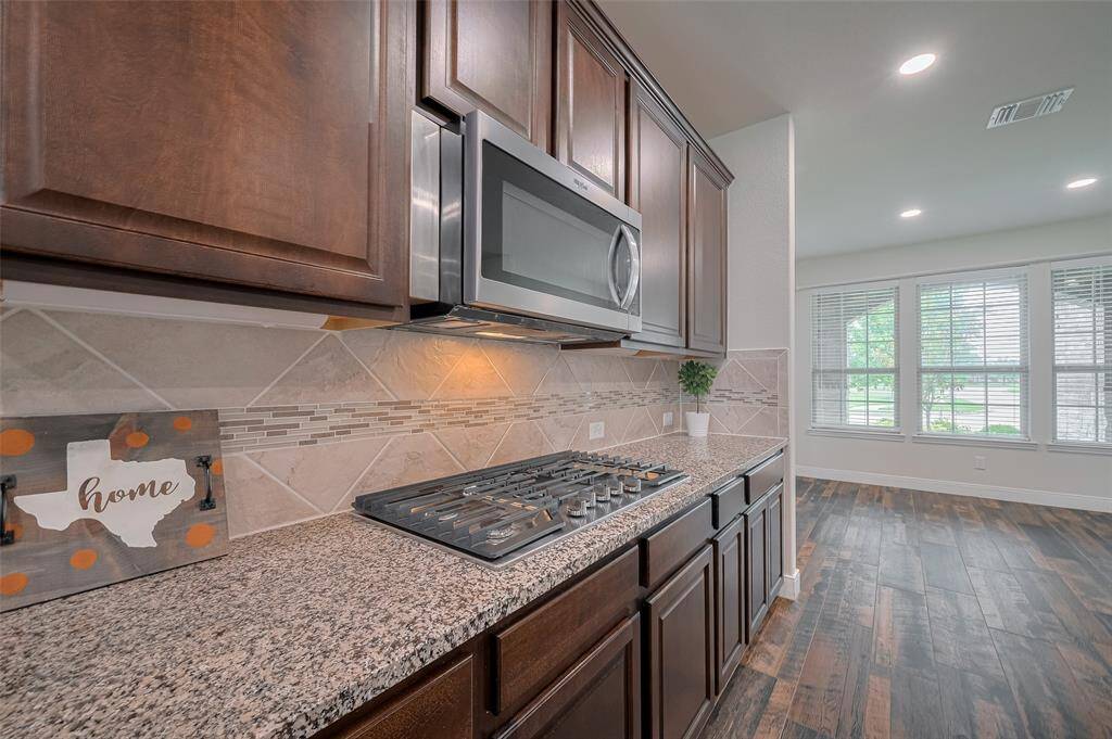 Kitchen offers a 5 burner stove, microwave, dishwasher and double ovens!