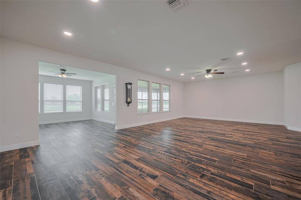 Another view of the dining, living and sunroom.