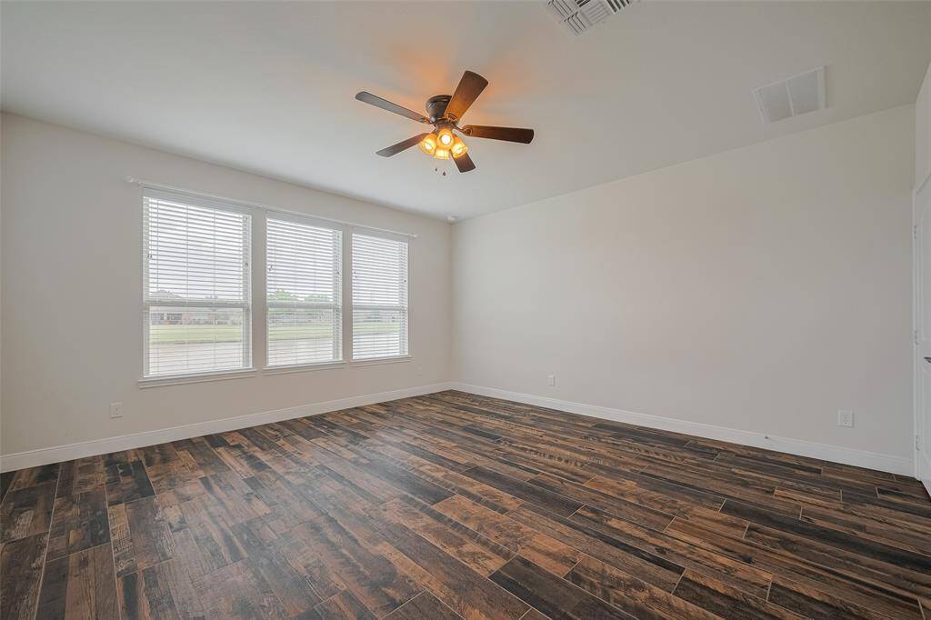 Light and airy spacious primary bedroom!