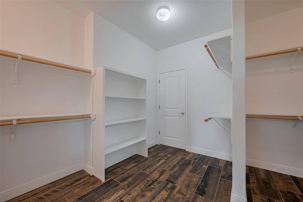 Master closet with door to laundry room. Door was added for easy access to laundry room.