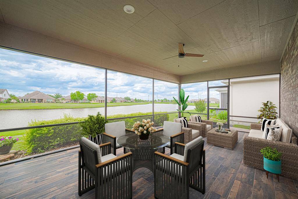 Back porch is screened in and has wonderful views of the lake. Virtual staged.