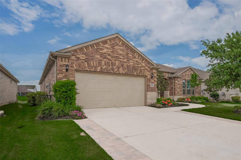 House offers an enhanced driveway with extra space and a 3 car tandem garage.