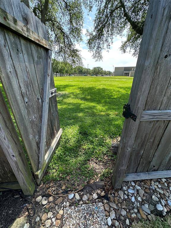 FENCE OPENS FROM BACKYARD TO THE SCHOOL YARD