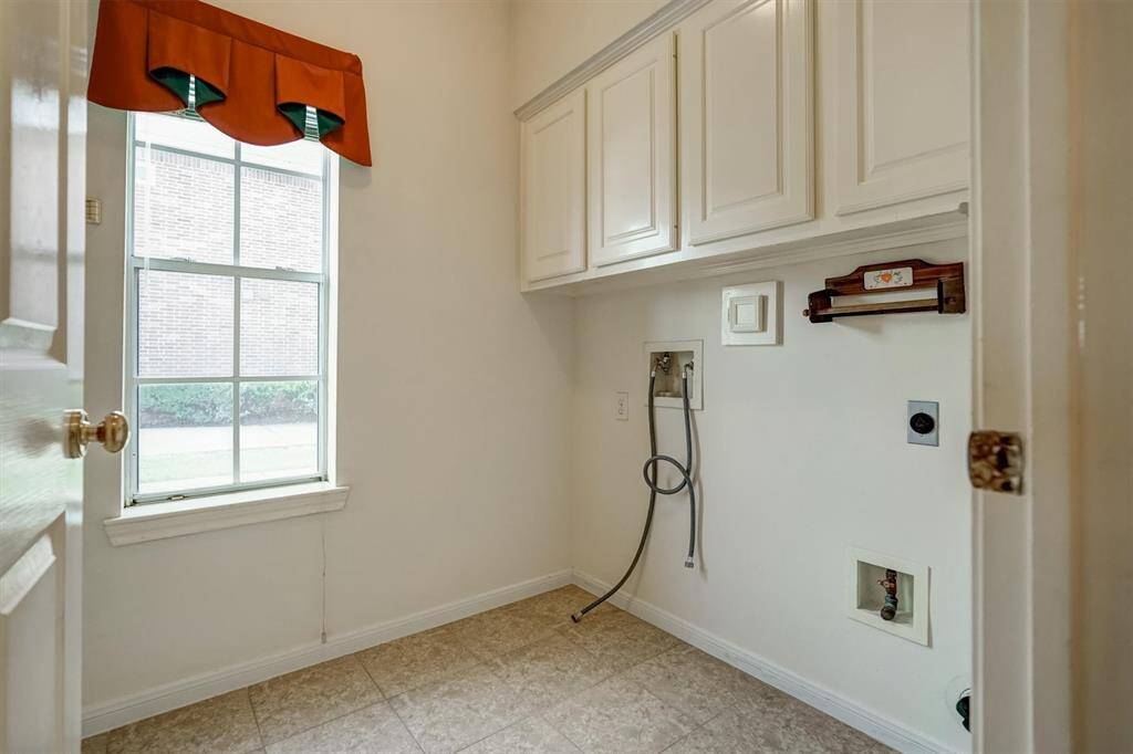 The laundry room with big window is equipped with washer connections, Plus both electric and gas connections for dryer