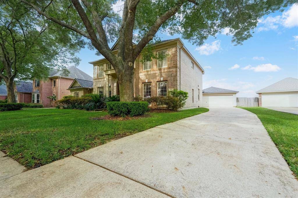 This beautiful two-story home with its striking brick façade—offering more brick and less siding for a classic, durable look. Long driveway provides enough parking space
