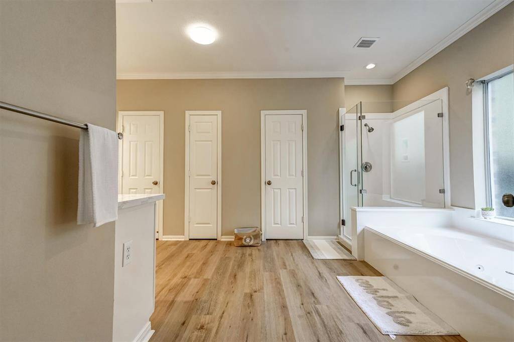 A spacious and serene master suite designed for ultimate comfort and style