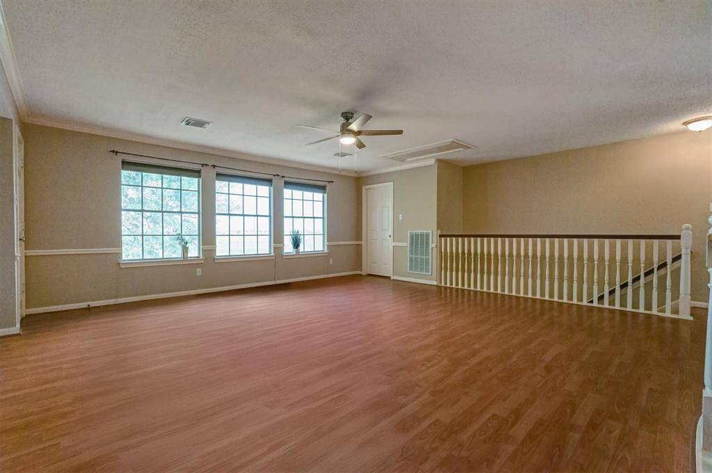 A large window brings in natural light, creating an open and inviting atmosphere perfect for gatherings, hobbies, or relaxing with family and friends.