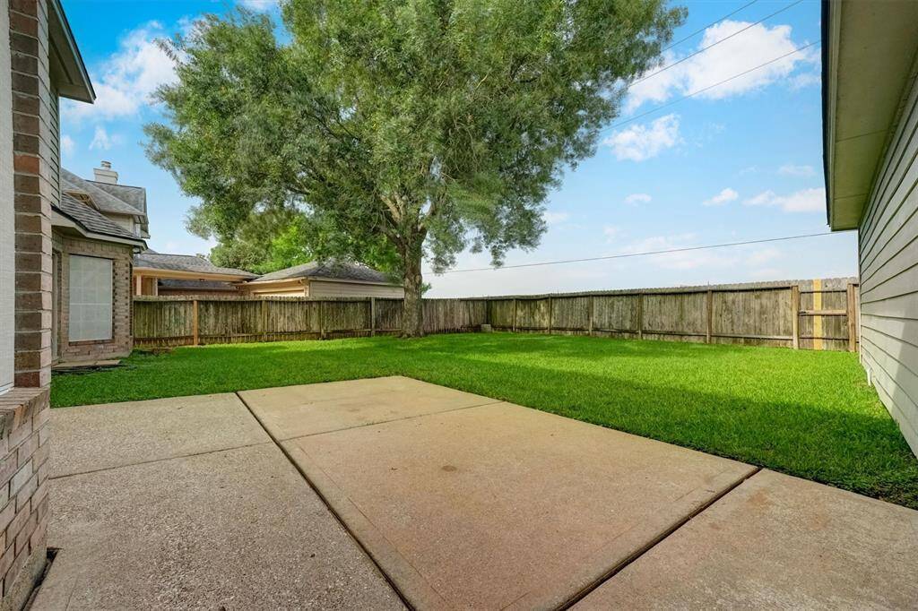 Enjoy peaceful outdoor living on the spacious patio, ideal for grilling or simply unwinding in a serene setting.