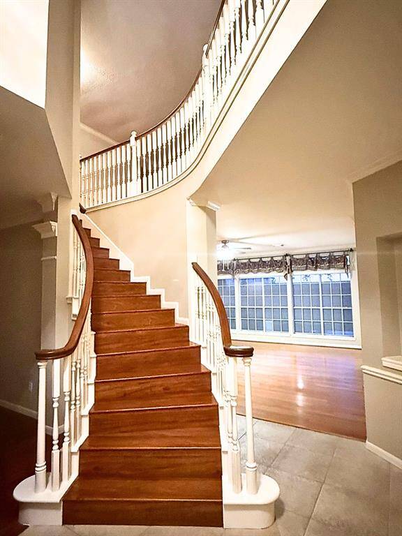 Beautifully crafted spiral staircase that adds a touch of elegance and seamlessly connecting to upper level.