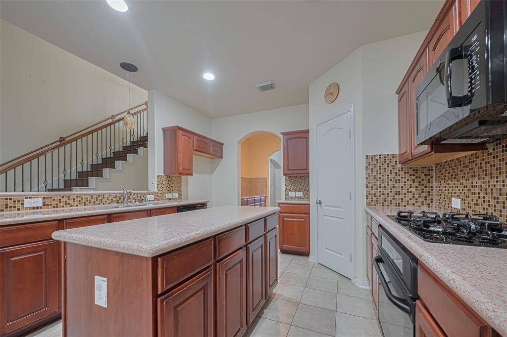 Along with the spacious kitchen is the butler's pantry.  Perfect for laying out a party spread or setting up a bar area.