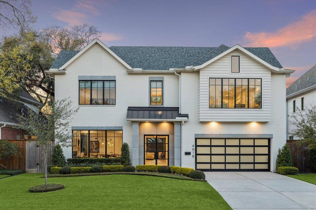 The home's timeless exterior features a sophisticated blend of brick and cement board finishes, accentuated by carefully curated landscaping. The inviting facade is both stately and warm, offering a striking first impression that sets the tone for the elegant interiors within.
