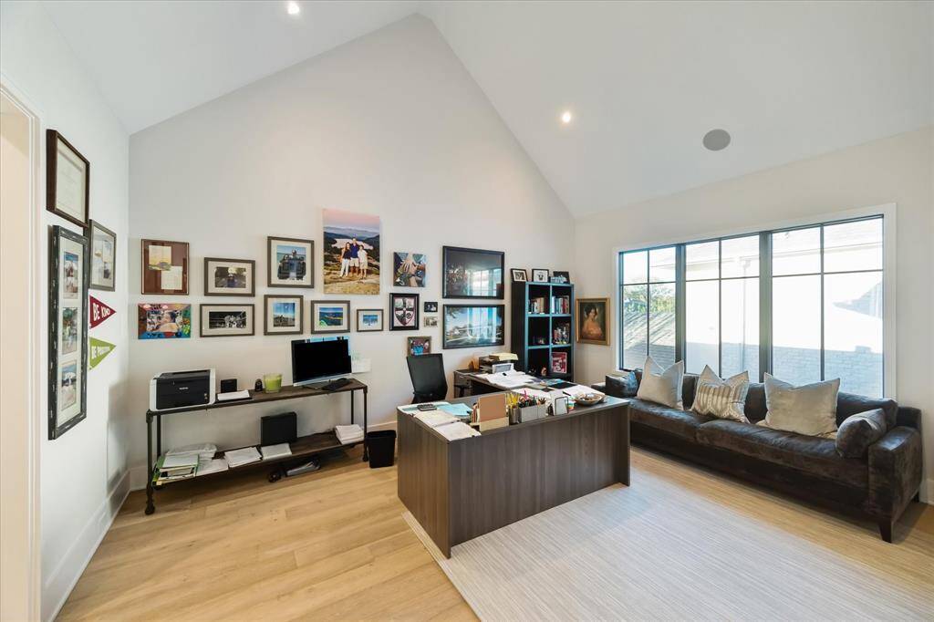 Guest bedroom #4 features vaulted ceilings, custom window treatments, and an ensuite bathroom with designer finishes. Its spacious layout offers comfort and style.