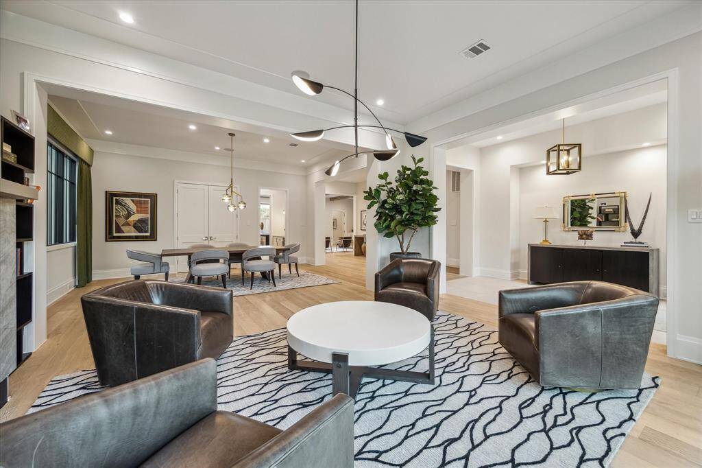 The formal living room’s refined design offers effortless connectivity to the foyer and formal dining room. Its open layout makes this space ideal for hosting and entertaining.