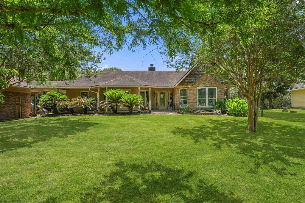 Welcome home to 4701 CR 747A in beautiful Brazoria! Such a classic look with mature landscaping