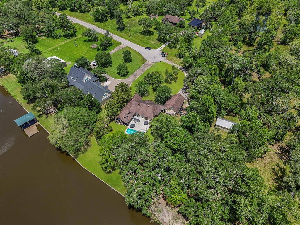Surrounded by trees, nestled right on the San Bernard River with 87 feet of riverfront.