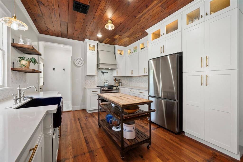 Designed in-cabinet lighting adds a touch of elegance.