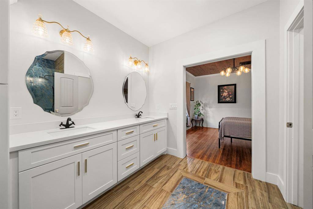 Double vanities and quartz counters.