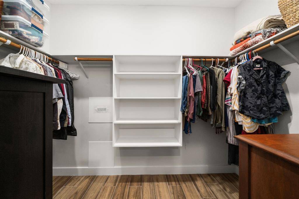 Large walk-in closet in primary suite.