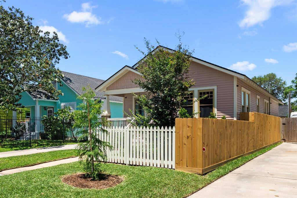 New fencing and exterior landscaping highlight this pircure-perfect home.