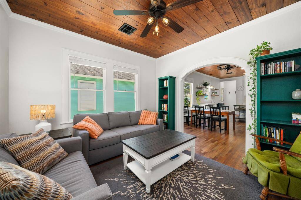 Beautiful open concept living with flooring consistent through the family room, dining, and kitchen.