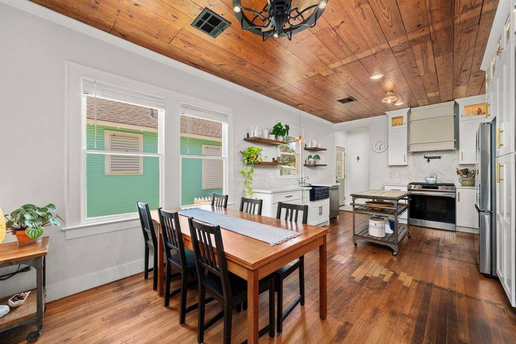 Dining / Breakfast room with stunning chandelier open to the kitchen.