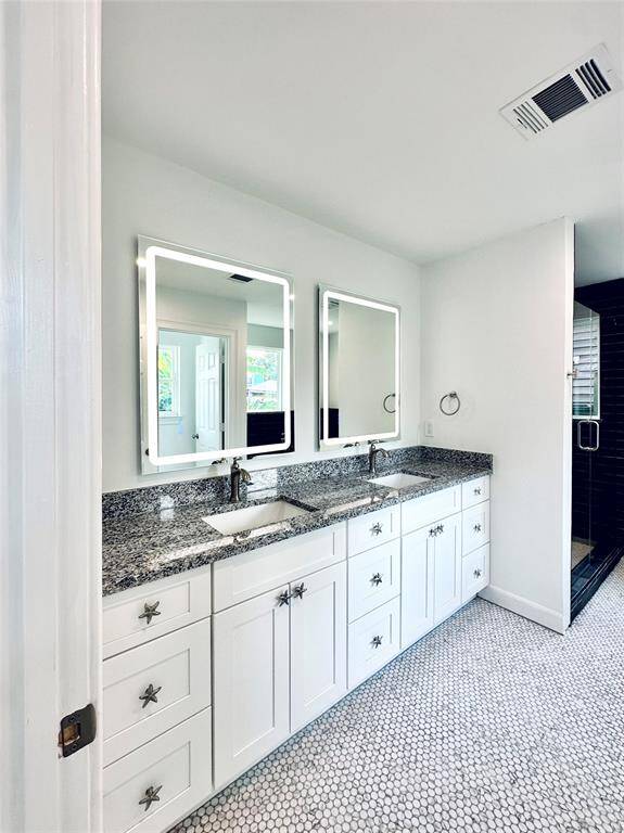 High end lighted mirrors above the double vanity