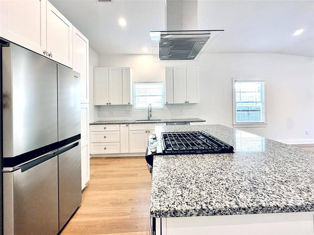 Stainless steel appliances in the galley kitchen