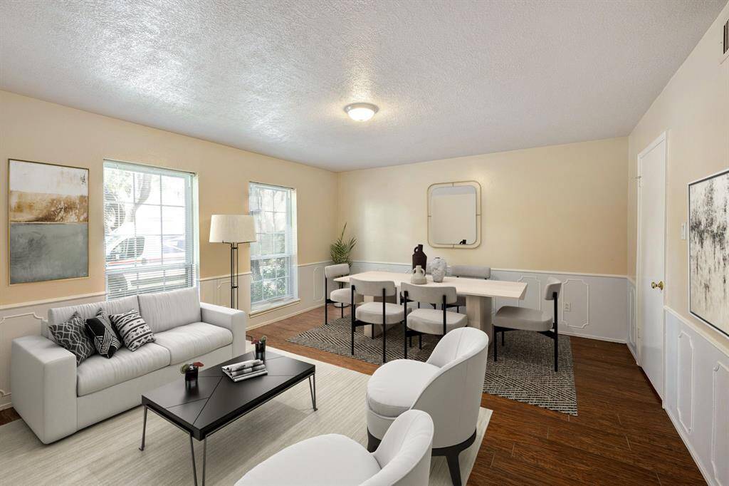 Virtually staged. Living room/dining or however you wish to use the spacious room. The door to the right goes to the kitchen