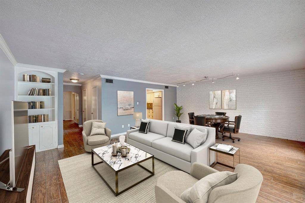 Virtually staged. Family Room with accent brick wall.