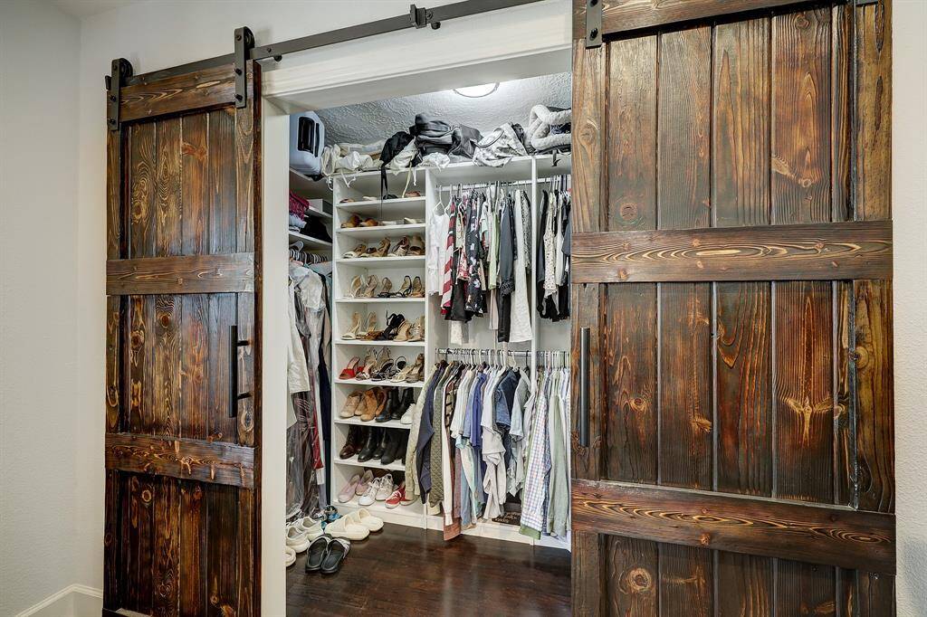 The current owners had the primary closet professionally custom outfitted with generous hanging and shelf space.