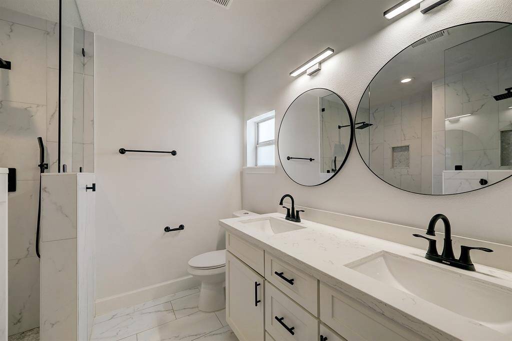 The well appointed primary bath offers very desirable amenities.