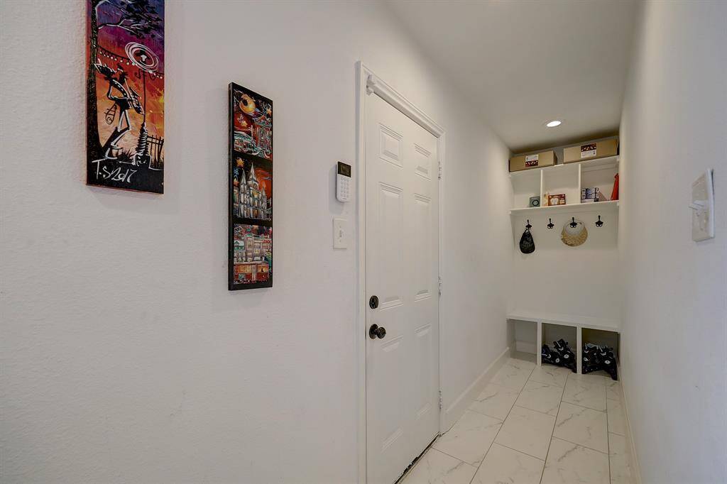 This mudroom area is just off the kitchen and the door on the left leads to the large back patio.