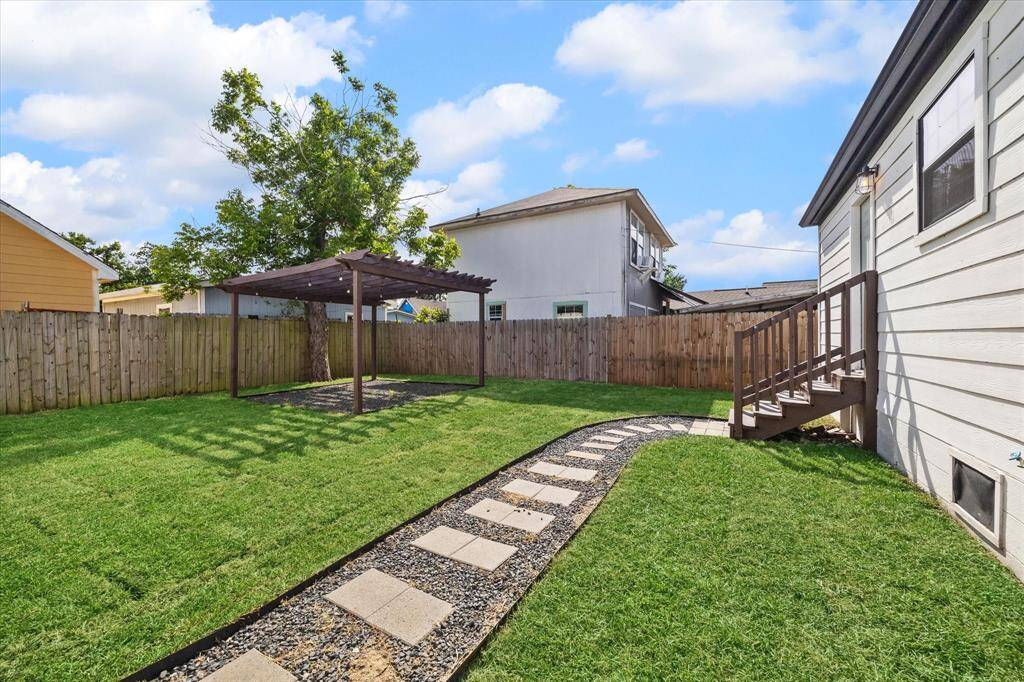 There is a walking path from the driveway and garage that leads to the back door.