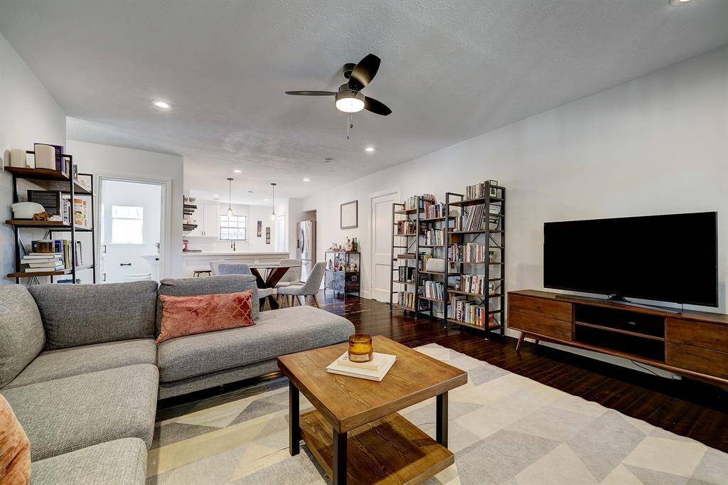 The living room is open to the dining room and kitchen creating a great flow to the space.